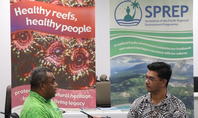 Director of Environment, Monitoring and Governance, Mr Jope Davetanivalu is being interviewed by journalist Marc Membere
